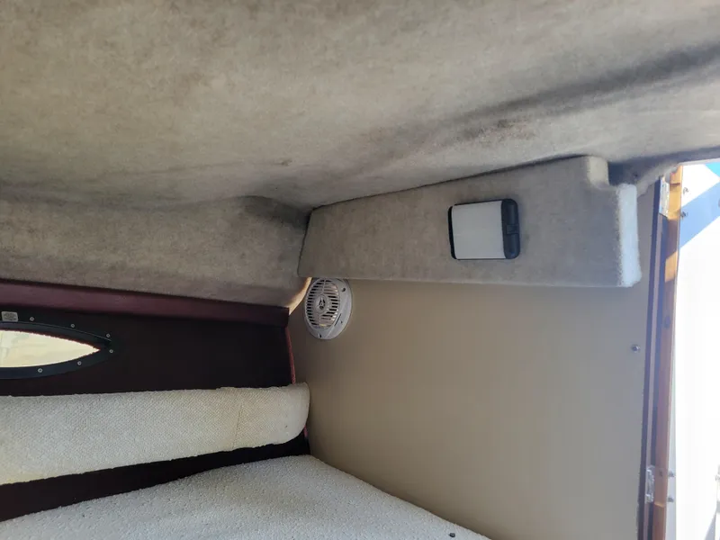 Slide: The Image of Interior cabin of a 1991 Maxum 2100 XC boat with speaker and light fixture. - 17