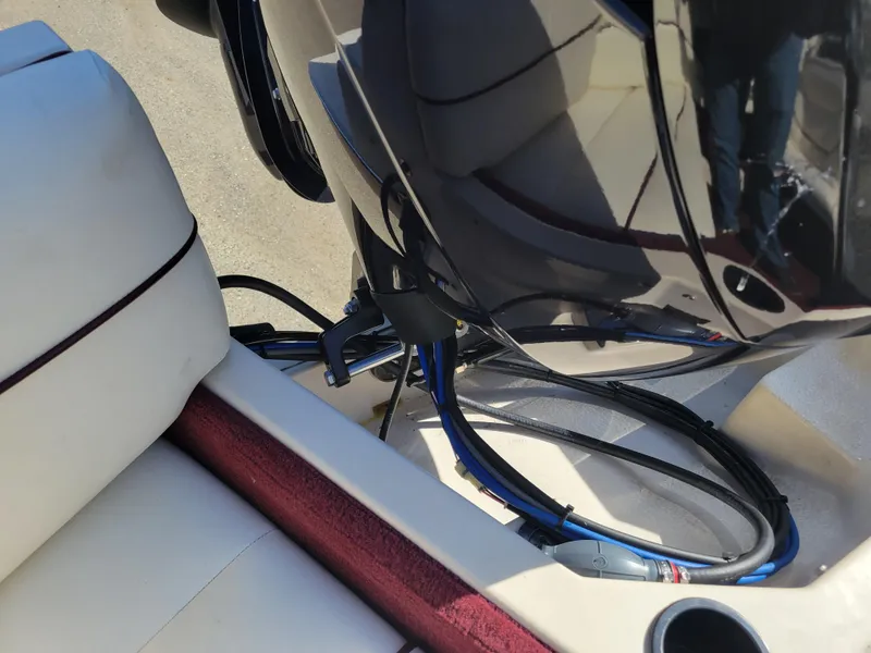 Slide: The Image of Close-up of the engine and seating area of a 1991 Maxum 2100 XC boat. - 23