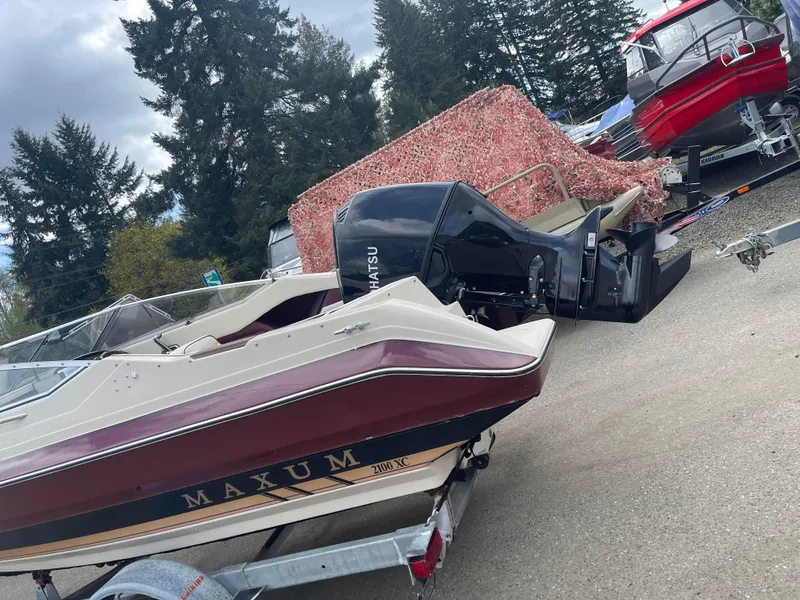 Slide: The Image of 1991 Maxum 2100 XC boat on trailer with Tohatsu outboard motor. - 24