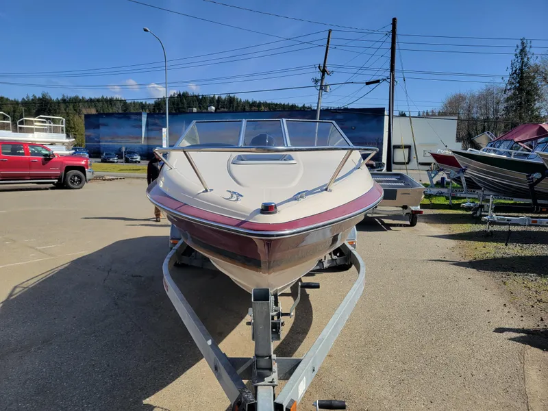 Slide: The Image of 1991 Maxum 2100 XC boat on a trailer in a parking lot. - 3