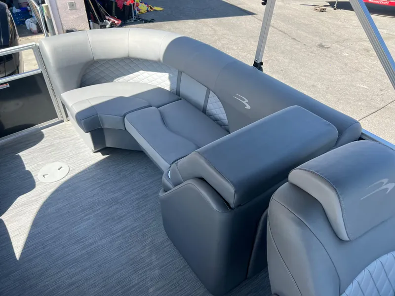 Slide: The Image of 2022 Bennington 23 L pontoon boat with luxurious gray seating. - 14