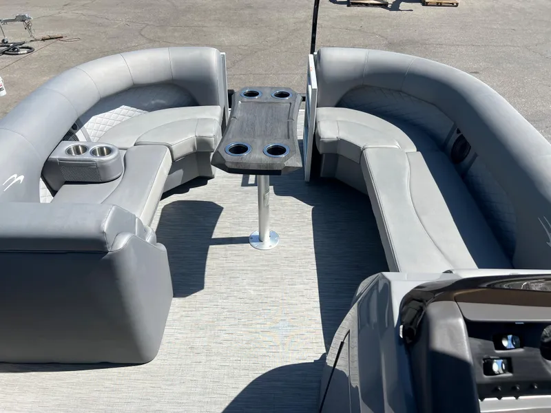 Slide: The Image of 2022 Bennington 23 L pontoon boat with gray seating and table. - 16