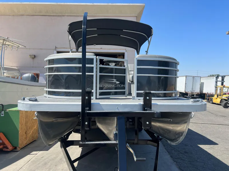 Slide: The Image of 2022 Bennington 23 L pontoon boat on trailer, front view. - 4