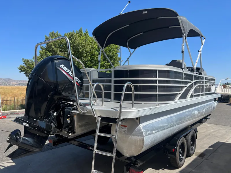 Slide: The Image of 2022 Bennington 23 L pontoon boat with Mercury outboard engine. - 5