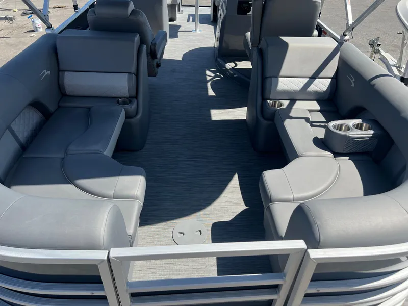 Slide: The Image of 2022 Bennington 23 L pontoon boat with spacious seating and modern interior. - 7