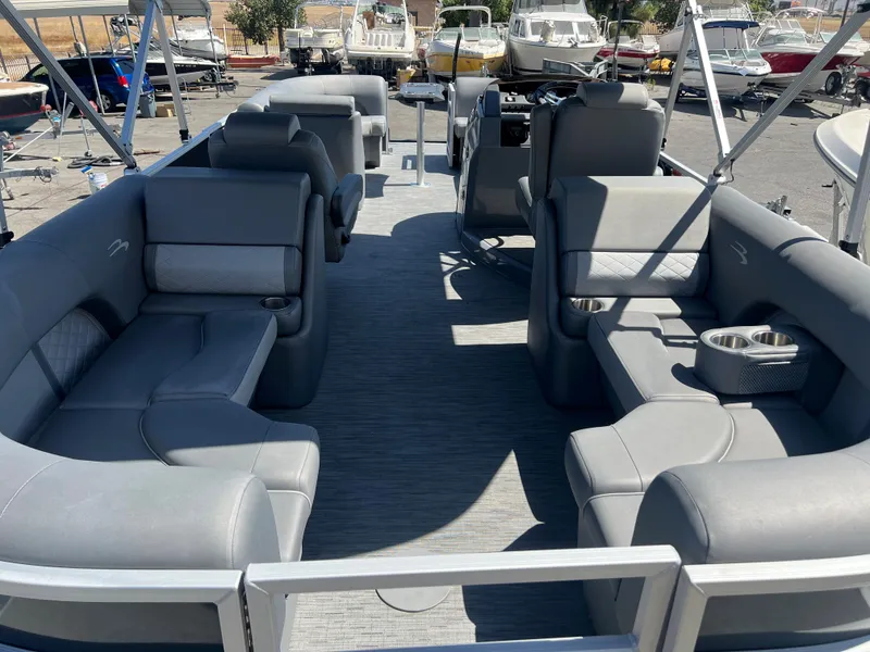 Slide: The Image of 2022 Bennington 23 L pontoon boat with spacious seating and modern design. - 8
