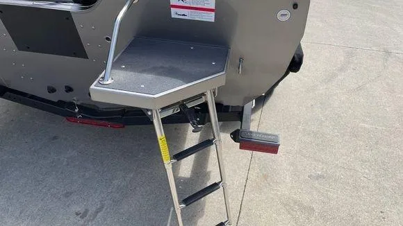 Slide: The Image of 2023 Crestliner 1750 Fish Hawk boat with rear boarding ladder and platform. - 5