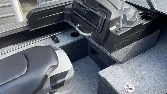 Slide: The Image of 2023 Crestliner 1750 Fish Hawk boat interior with seating and storage compartments. - 6