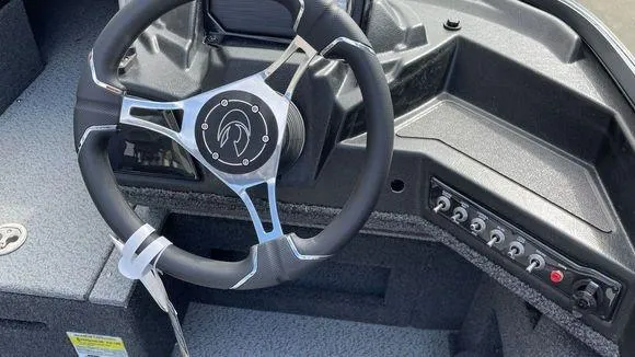 Slide: The Image of 2023 Crestliner 1750 Fish Hawk steering wheel and control panel. - 7