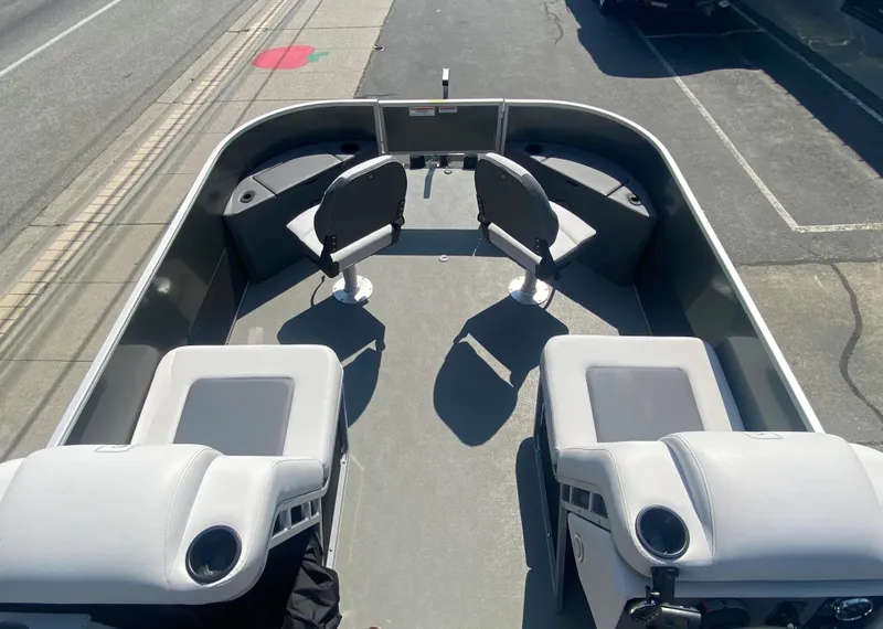 Slide: The Image of 2023 Godfrey MIGHTY G 1476F boat interior with seating and storage compartments. - 3