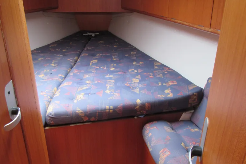 Slide: The Image of Cozy cabin interior of 2000 X-Yachts X-412 with patterned bedding. - 17