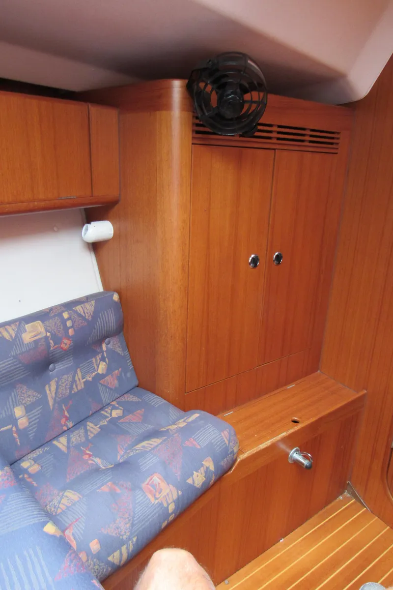 Slide: The Image of Interior of 2000 X-Yachts X-412 with wooden cabinetry and patterned seating. - 18
