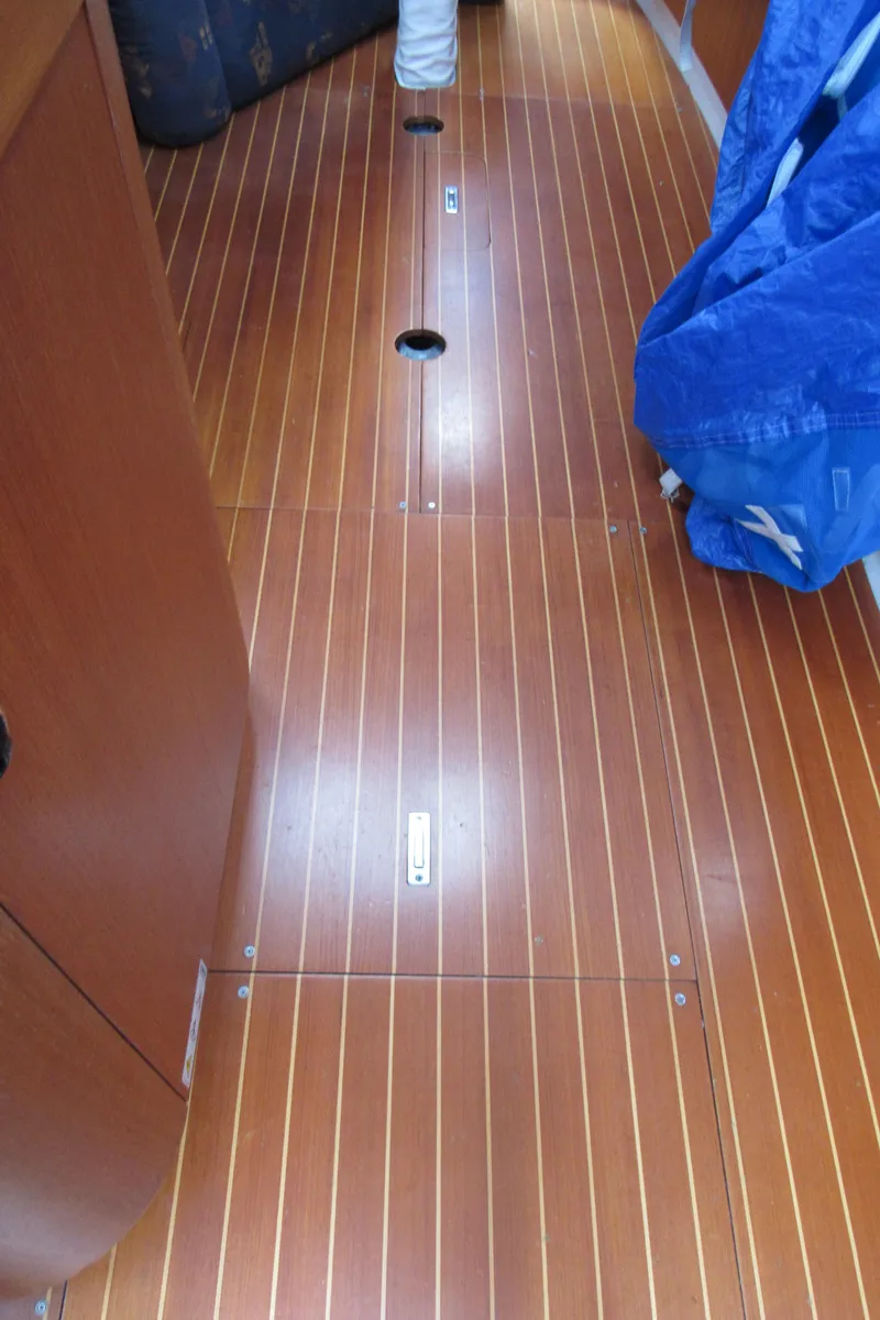 Slide: The Image of Teak interior flooring of 2000 X-Yachts X-412 sailboat, featuring sleek design and craftsmanship. - 19