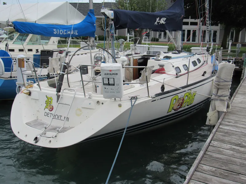 Slide: The Image of Sailboat X-Yachts X-412, 2000 model, docked at marina with visible deck and equipment. - 2