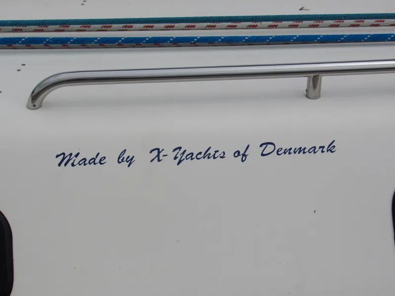 Slide: The Image of X-Yachts X-412, 2000 model, Danish craftsmanship, boat detail with railing and text. - 3