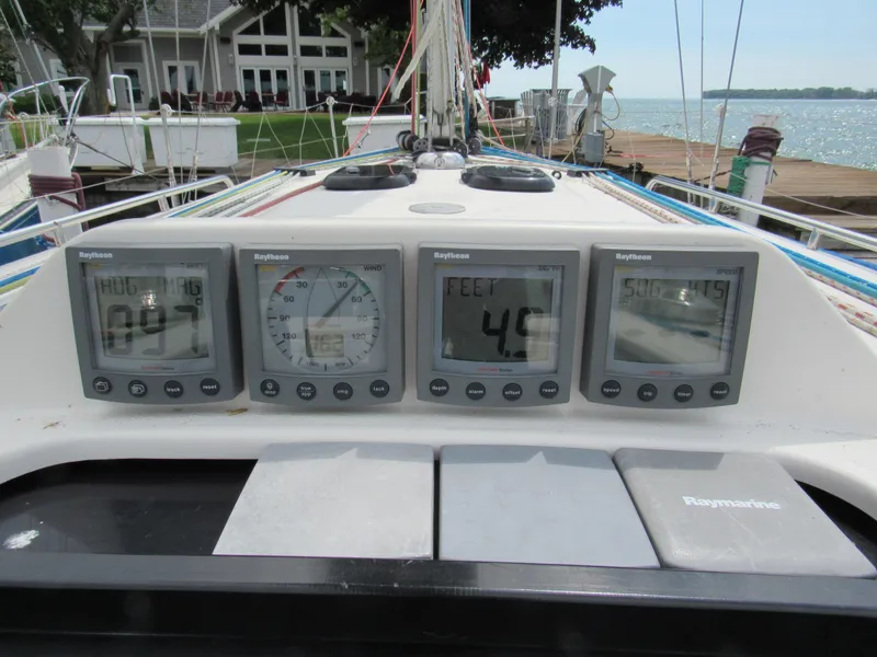 Slide: The Image of Cockpit instruments on a 2000 X-Yachts X-412 sailboat, displaying navigation data. - 32