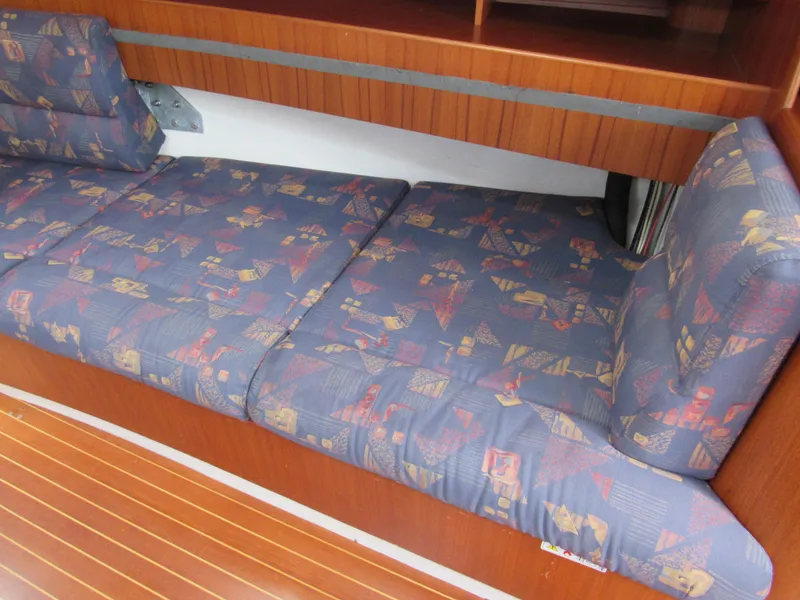 Slide: The Image of 2000 X-Yachts X-412 interior with patterned cushions and wooden flooring. - 7