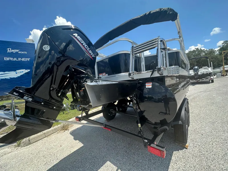 Slide: The Image of 2024 Ranger Reata 200F boat with Mercury outboard motor on trailer. - 14