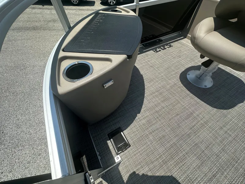 Slide: The Image of 2024 Ranger Reata 200F boat interior with cup holder and seating. - 2