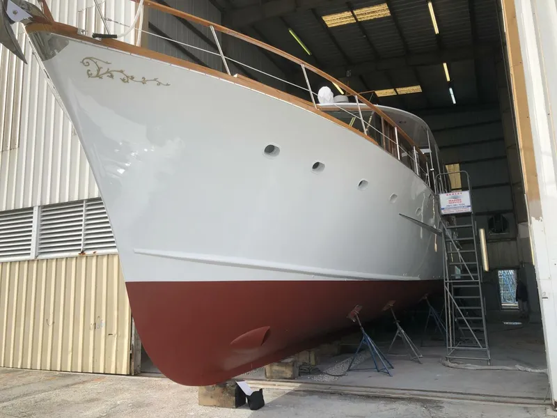 Slide: The Image of 1972 Trumpy 72 Houseboat in dry dock for maintenance. - 3