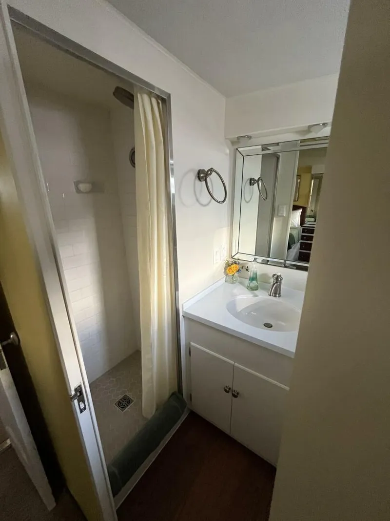 Slide: The Image of 1972 Trumpy 72 Houseboat bathroom with shower and vanity sink. - 30