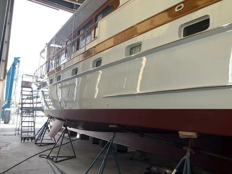 Slide: The Image of 1972 Trumpy 72 Houseboat in dry dock for maintenance. - 6