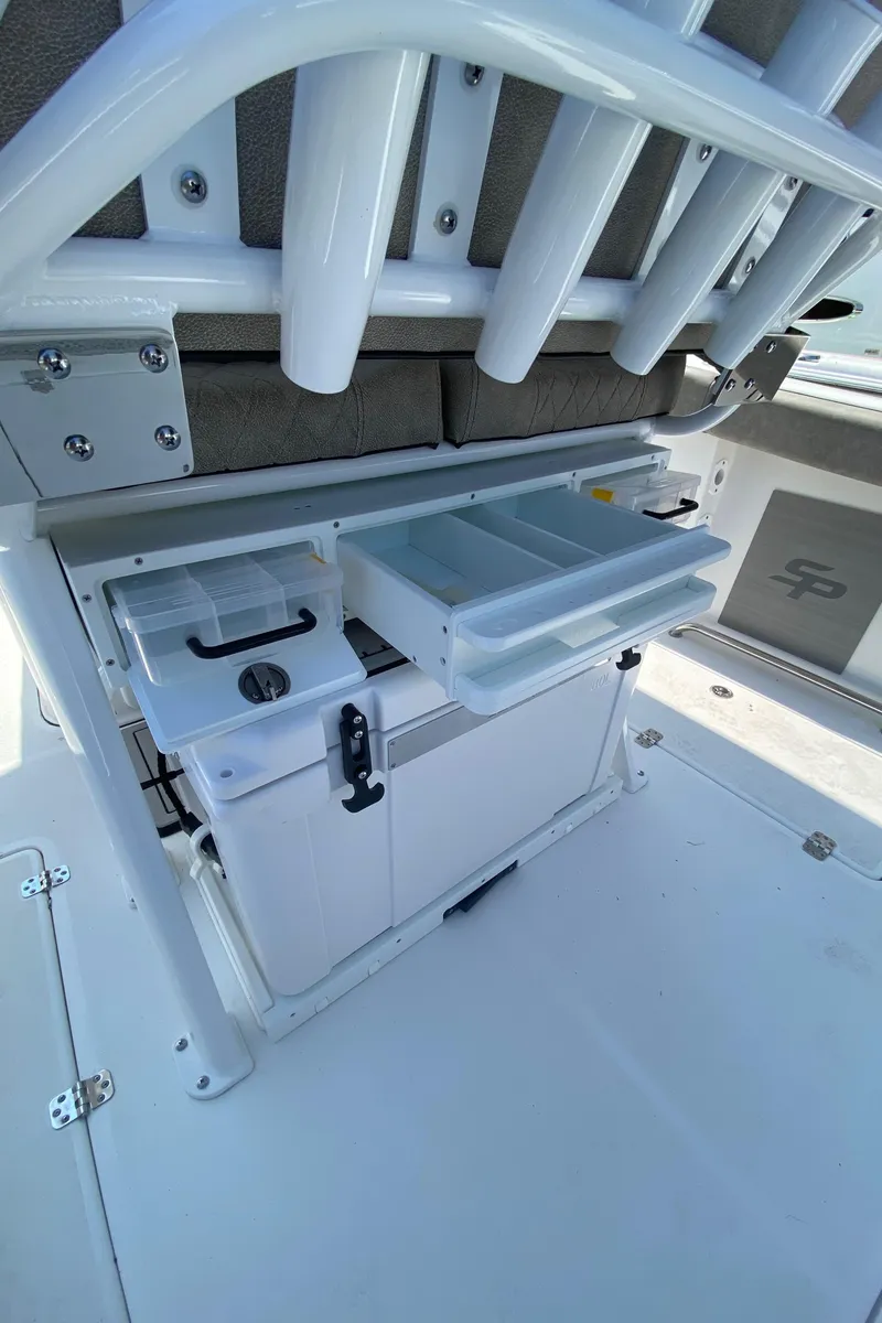 Slide: The Image of 2023 Sea Pro 259 boat with storage compartments and rod holders. - 10