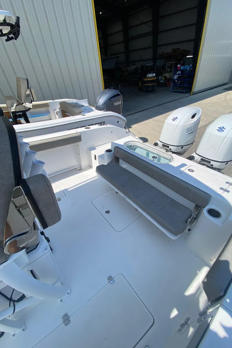 Slide: The Image of 2023 Sea Pro 259 boat interior with dual outboard motors. - 5