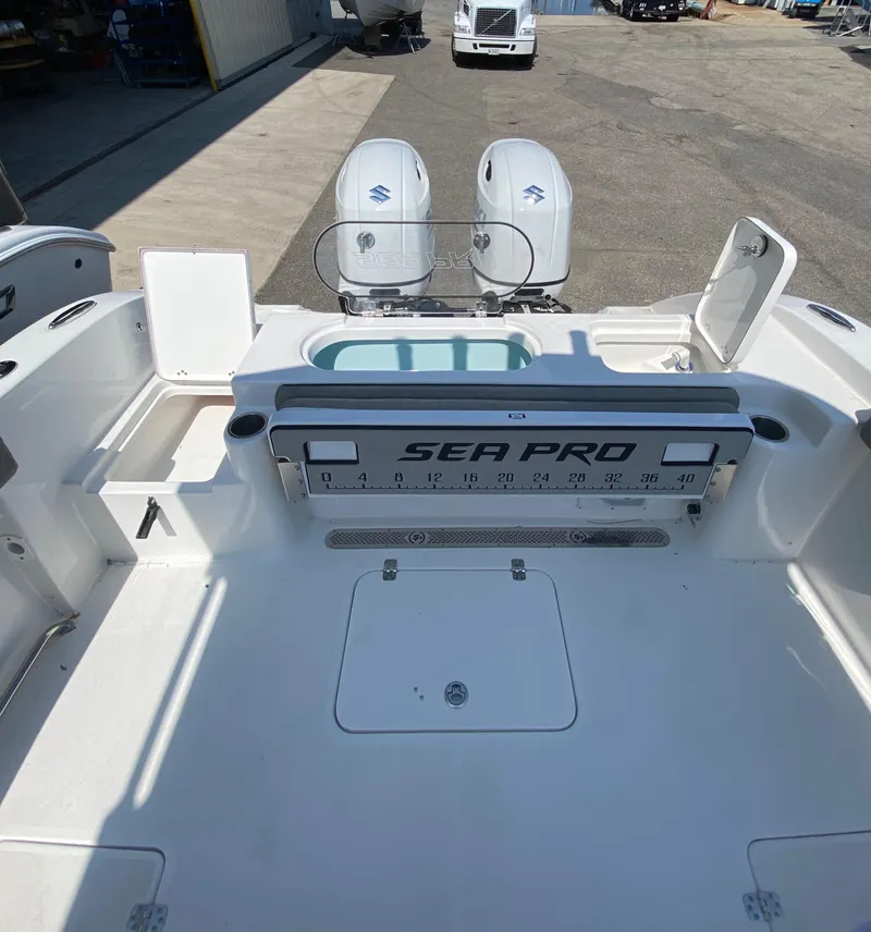 Slide: The Image of 2023 Sea Pro 259 boat deck with dual outboard motors. - 7