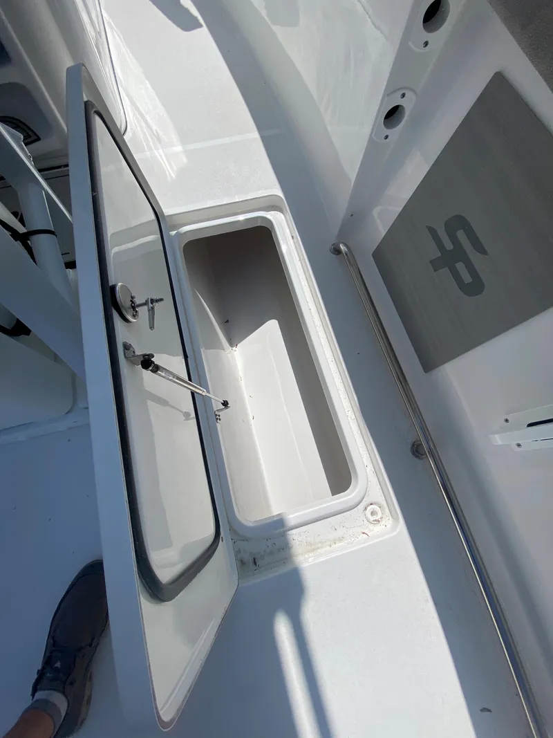 Slide: The Image of 2023 Sea Pro 259 boat storage compartment with open hatch. - 8