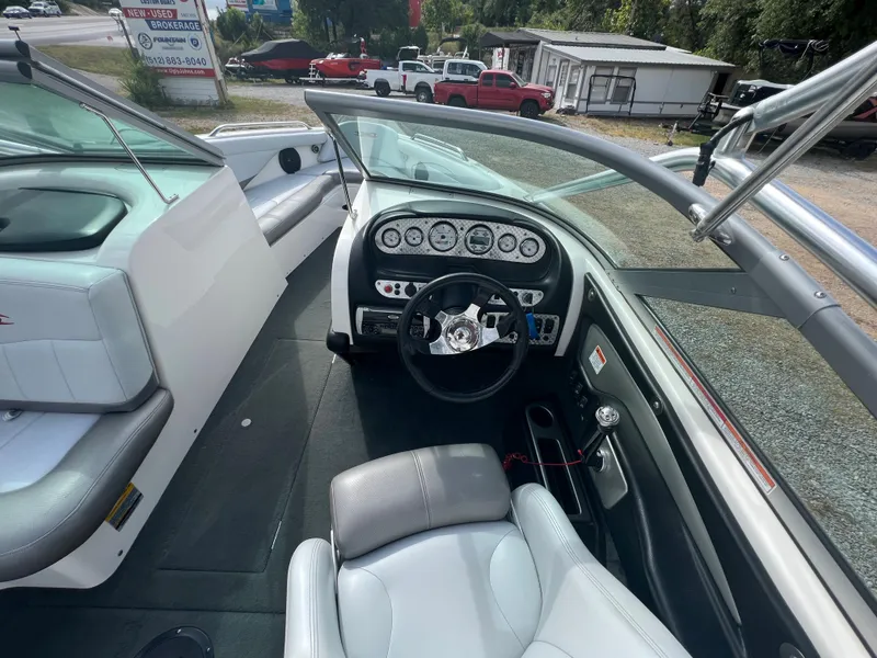 Slide: The Image of 2004 MasterCraft X30 boat interior with steering wheel and dashboard. - 7