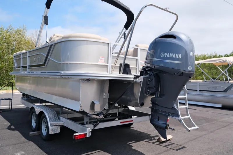 Slide: The Image of 2023 SunCatcher Fusion 322RC pontoon boat with Yamaha outboard motor on trailer. - 3