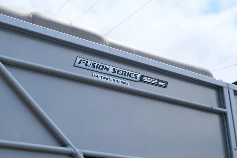 Slide: The Image of 2023 SunCatcher Fusion 322RC Saltwater Series boat detail with logo. - 5