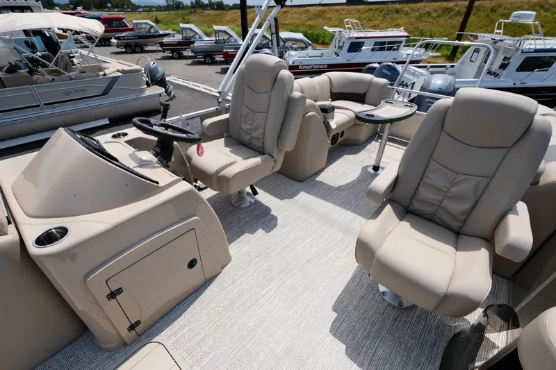 Slide: The Image of 2023 SunCatcher Fusion 322RC boat interior with plush seating and modern design. - 9