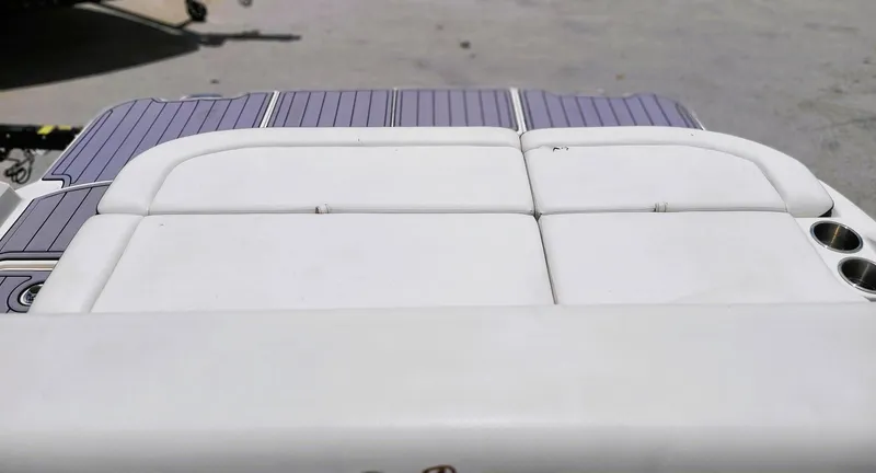 Slide: The Image of 2018 Sea Ray 270 SDX boat with white cushioned seating and gray deck. - 8