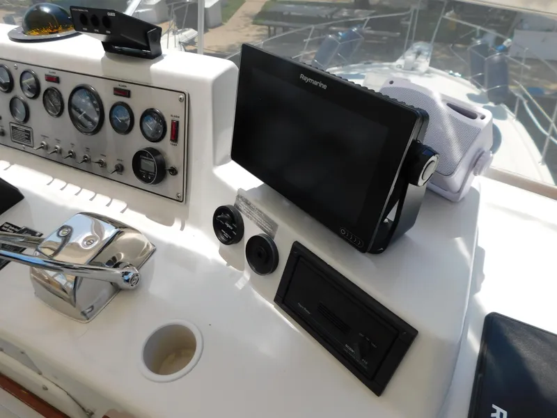 Slide: The Image of 1988 Chris-Craft 426 Catalina helm with navigation equipment and control panel. - 10