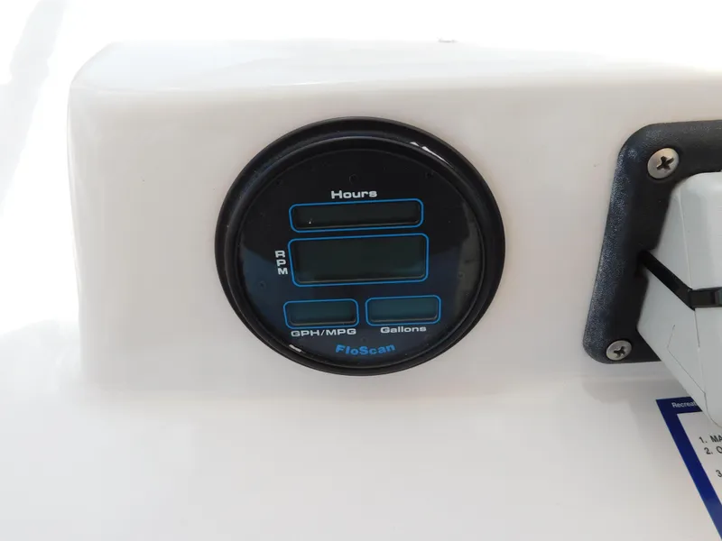 Slide: The Image of Digital gauge on 1988 Chris-Craft 426 Catalina boat dashboard, displaying hours and fuel metrics. - 12