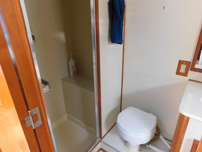 Slide: The Image of 1988 Chris-Craft 426 Catalina bathroom with shower and toilet. - 21
