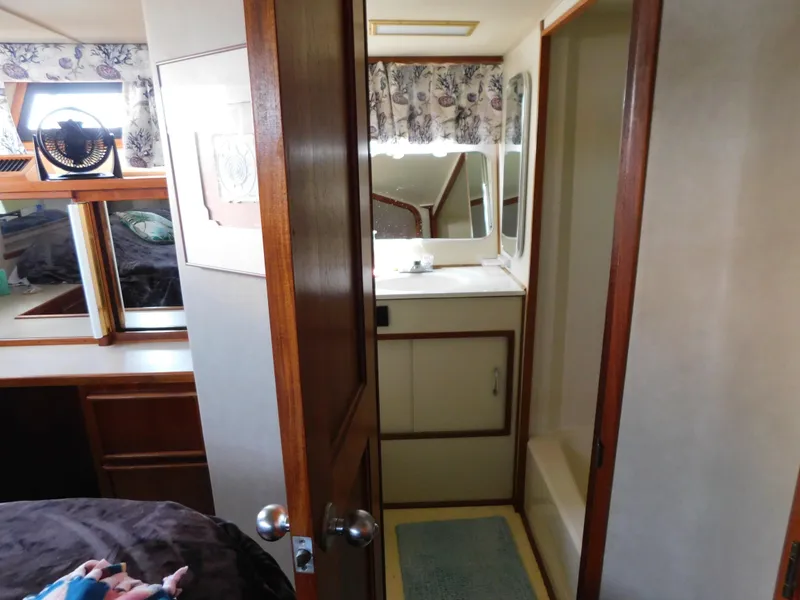 Slide: The Image of Interior of 1988 Chris-Craft 426 Catalina yacht showing bathroom and bedroom area. - 29