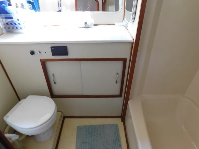 Slide: The Image of Bathroom interior of 1988 Chris-Craft 426 Catalina yacht with toilet, sink, and shower. - 30