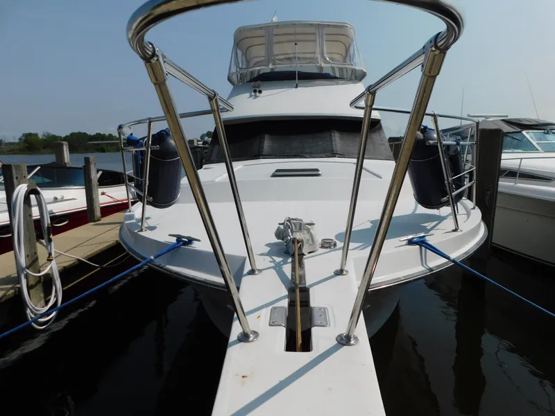 Slide: The Image of 1988 Chris-Craft 426 Catalina yacht docked at marina, front view. - 33