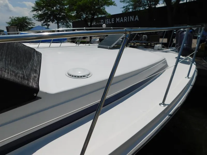 Slide: The Image of 1988 Chris-Craft 426 Catalina yacht at Grand Isle Marina, featuring sleek deck design. - 4
