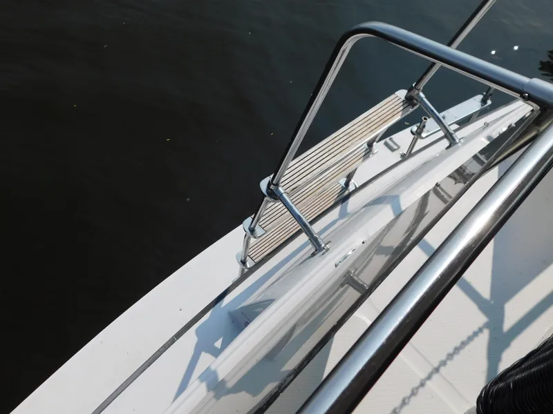 Slide: The Image of 1988 Chris-Craft 426 Catalina yacht deck with railing over water. - 41