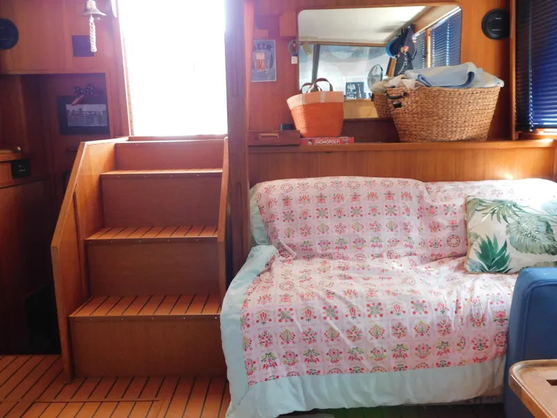 Slide: The Image of Interior of 1988 Chris-Craft 426 Catalina with cozy seating and wooden stairs. - 46