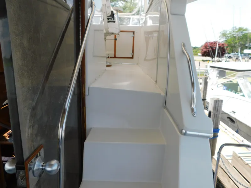 Slide: The Image of Stairway on 1988 Chris-Craft 426 Catalina yacht, leading to upper deck. - 7