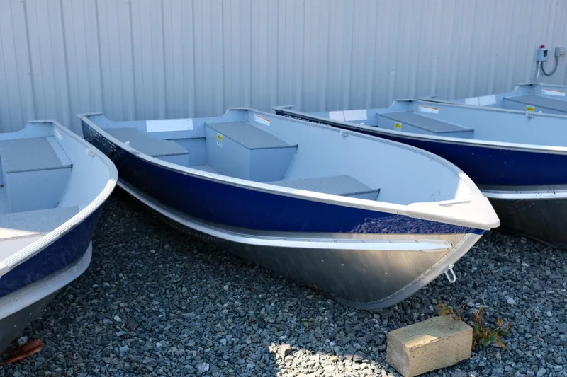 The Image of 2023 Crestliner 1261 Outreach aluminum boats displayed outdoors. - 0