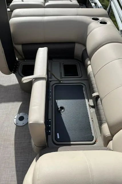 Slide: The Image of 2024 Sun Tracker SportFish 22 DLX pontoon boat seating and storage compartments. - 10