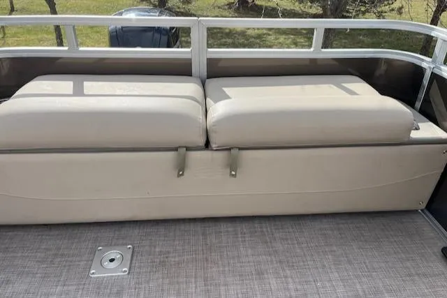 Slide: The Image of 2024 Sun Tracker SportFish 22 DLX boat interior seating and deck. - 2