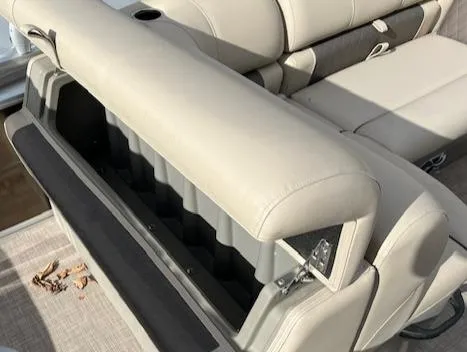 Slide: The Image of 2024 Sun Tracker SportFish 22 DLX boat seat storage compartment. - 5