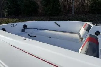 Slide: The Image of 2024 Tahoe T18 boat interior with white and red seating, sleek design. - 4